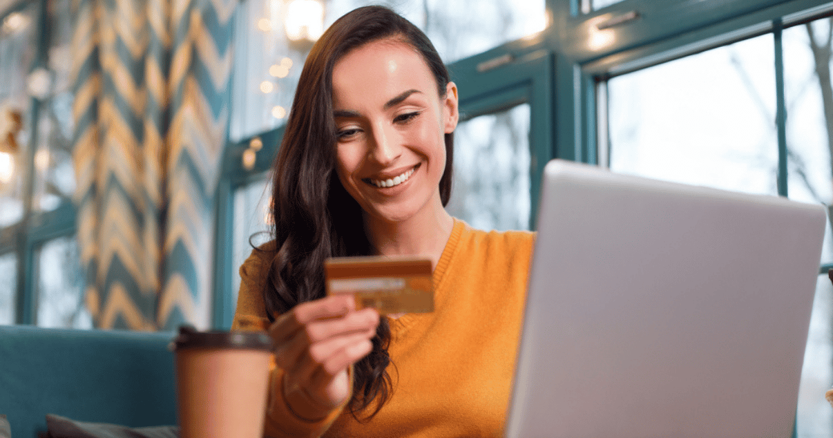 Woman holding her credit card while learning about the payment methods offered by Billforward